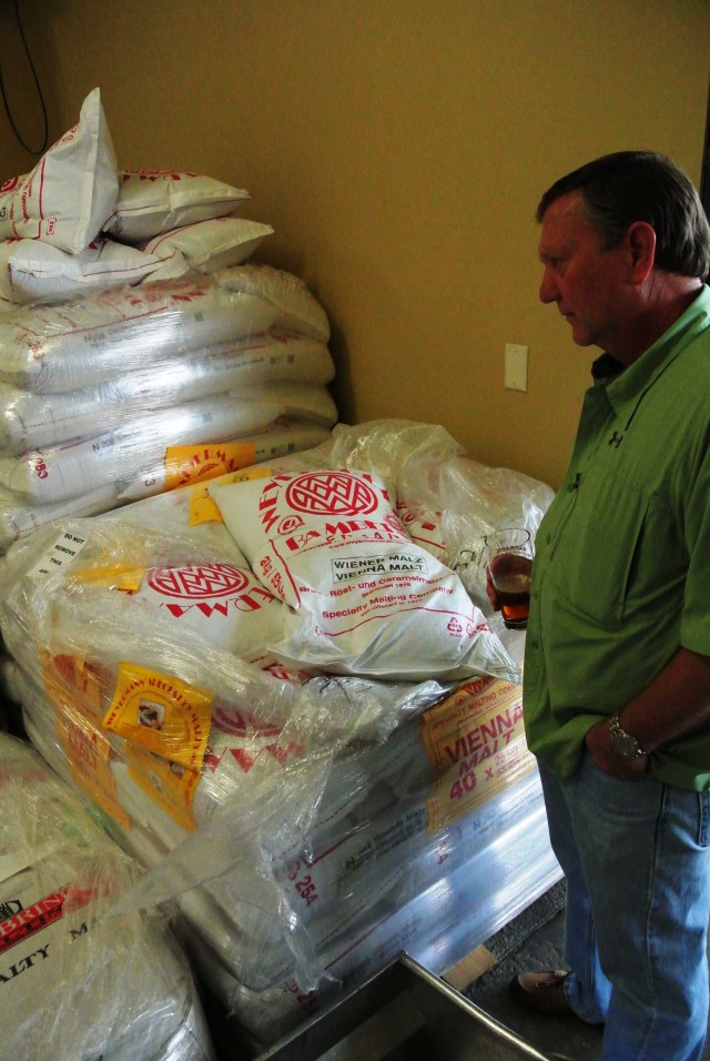 John taking a gander at the grain bags waiting their turn to become elixirs of the gods.