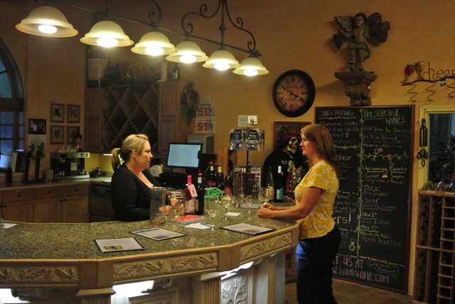 Kathy chatting with Sarah at Haak Winery in the tasting room